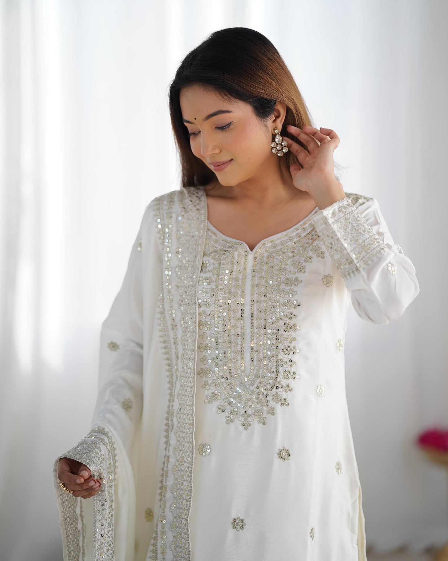 Luxurious Chinnon Silk sharara set with heavy embroidery & sequence work.