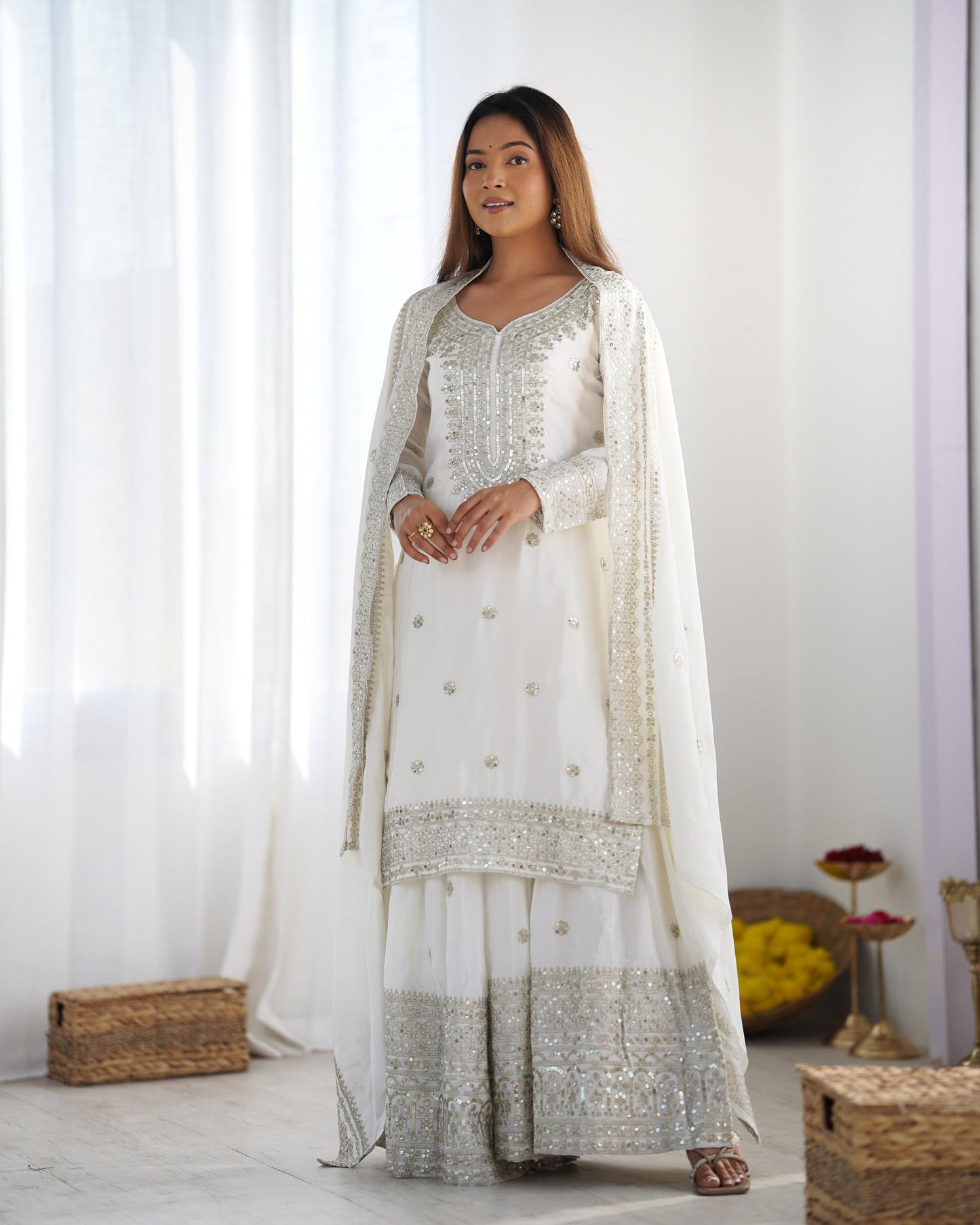 Luxurious Chinnon Silk sharara set with heavy embroidery & sequence work.